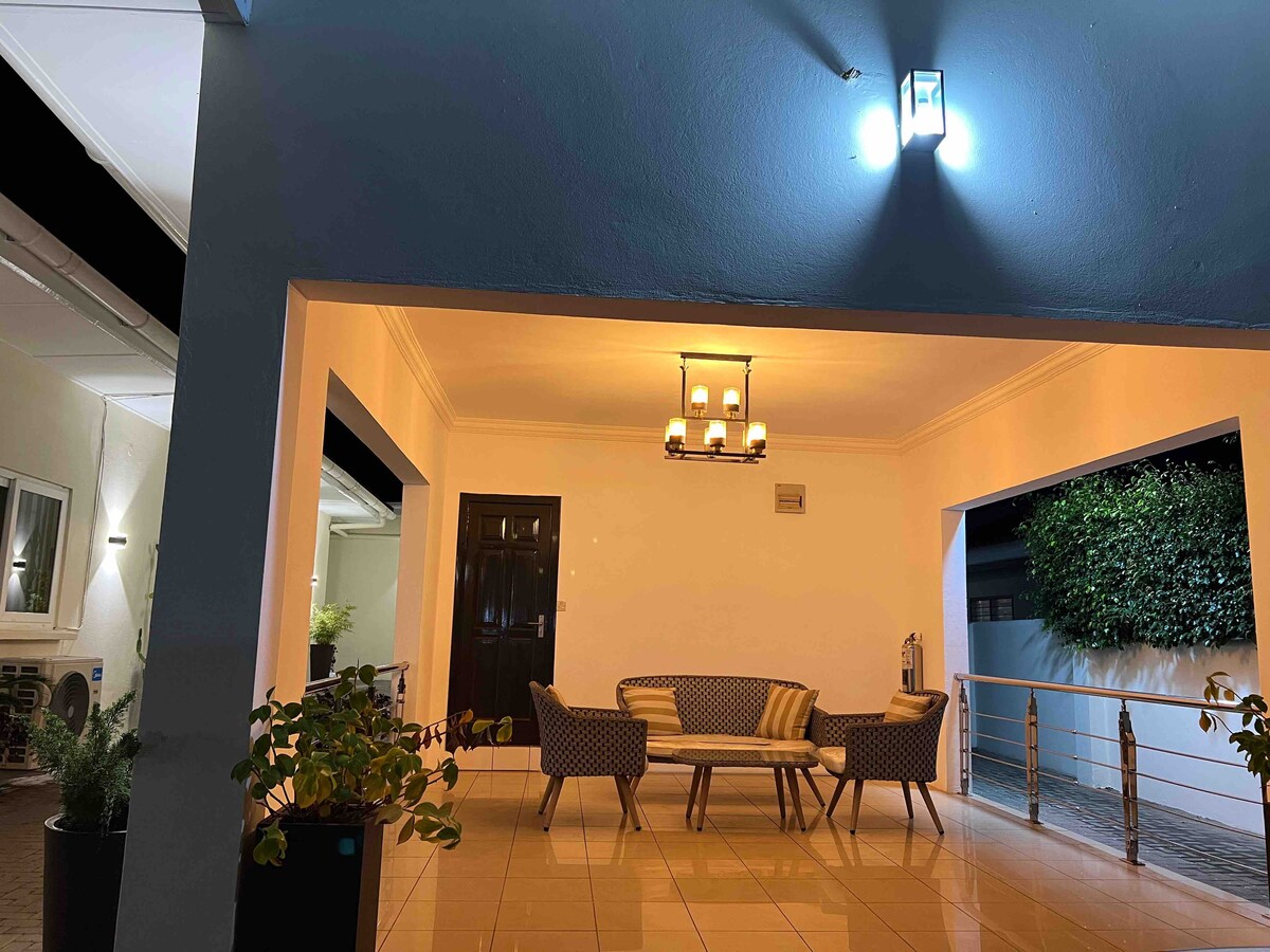 The Premium Stay exterior at night